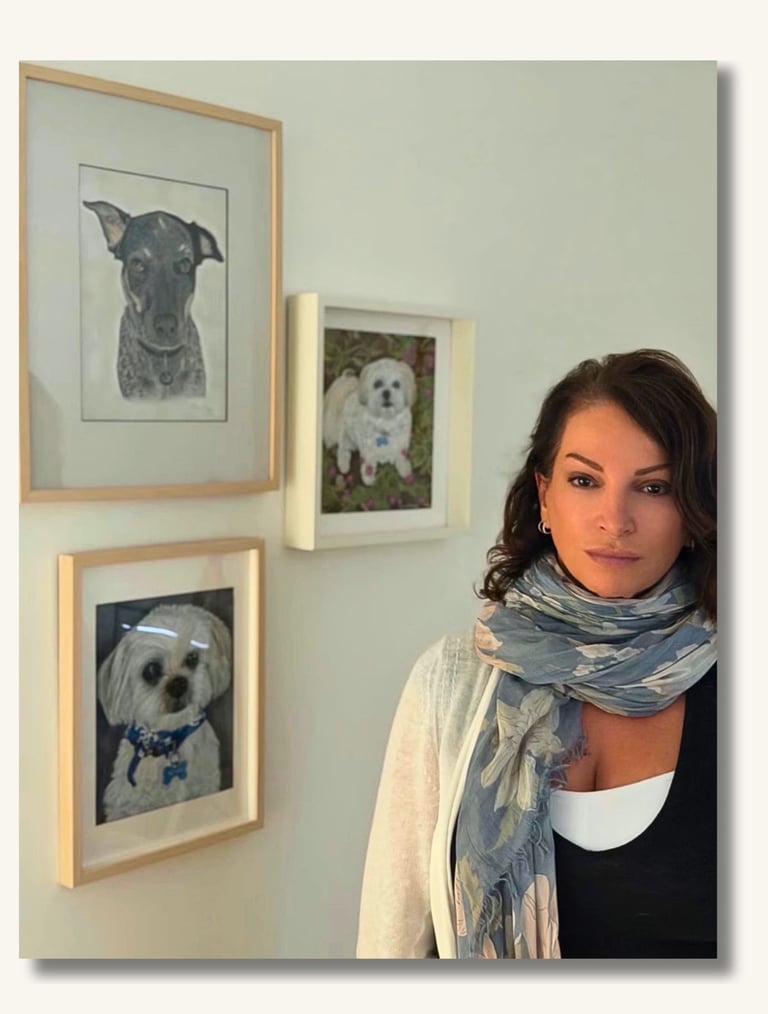 Sharan Miller with pet portrait artwork in her Australian art studio