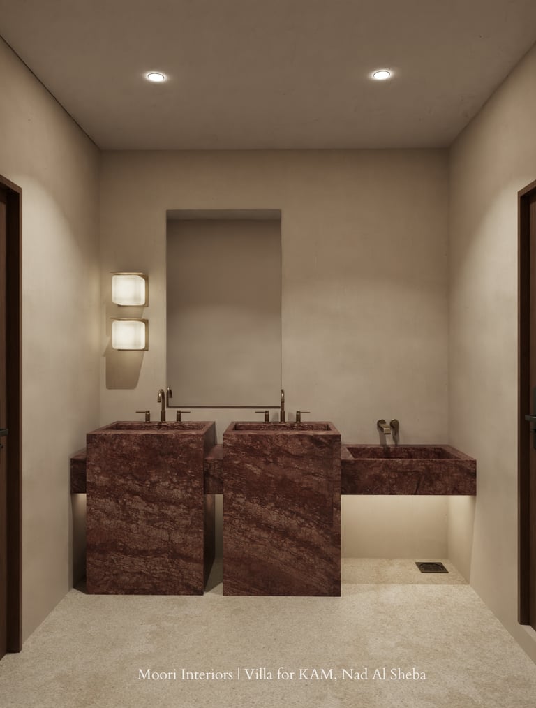 Bathroom interior with warm cove lighting beneath the right sink and wall-mounted lights