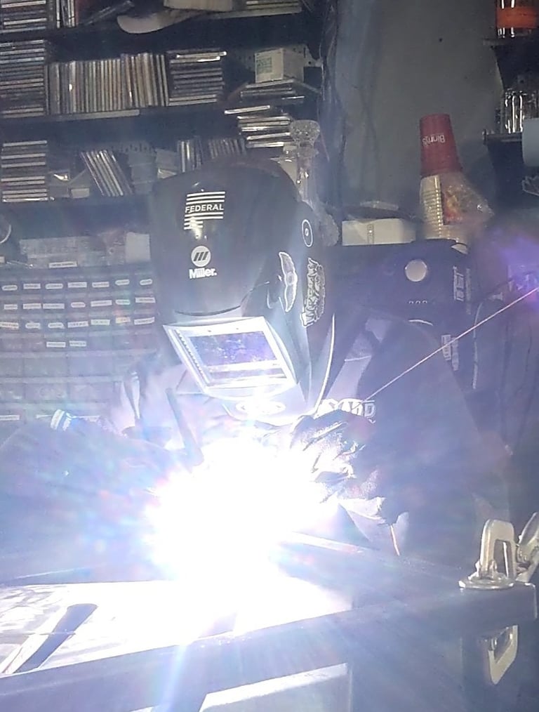 Welding a miter joint in my garage. Building the frame for my bar..