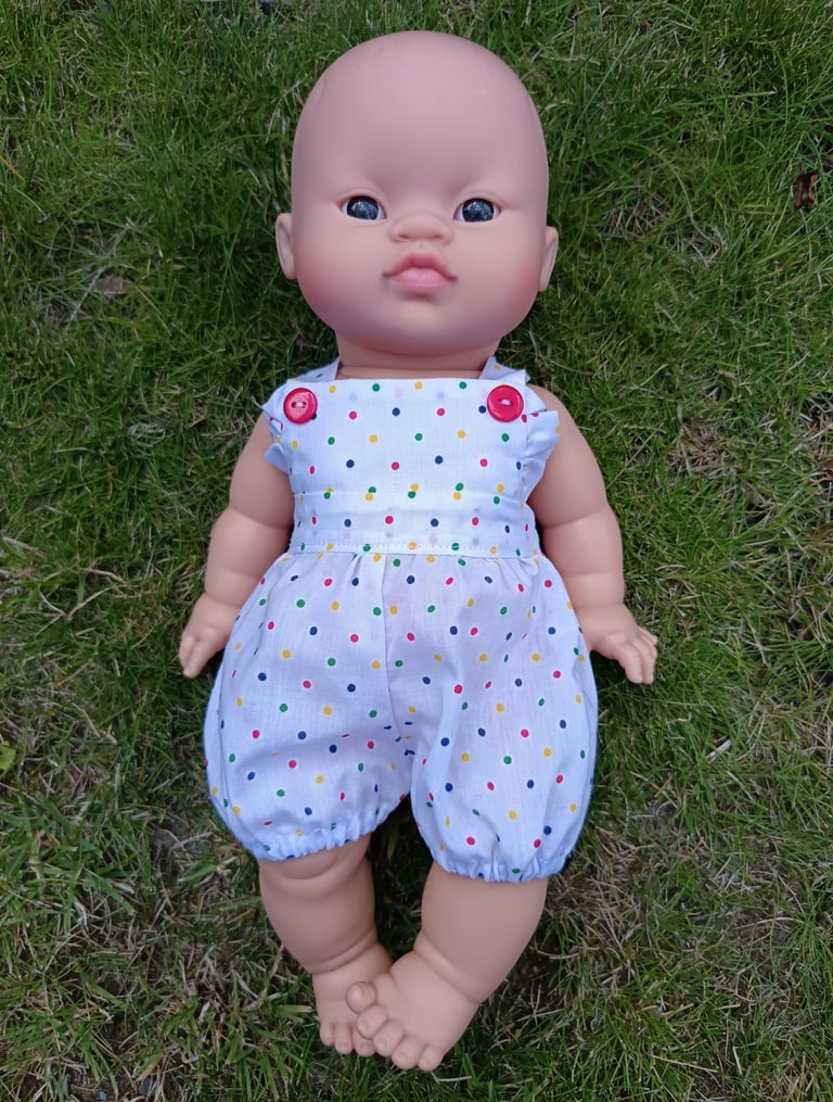 Minikane doll Mai Ly dressed in a tiny polka dot summer romper