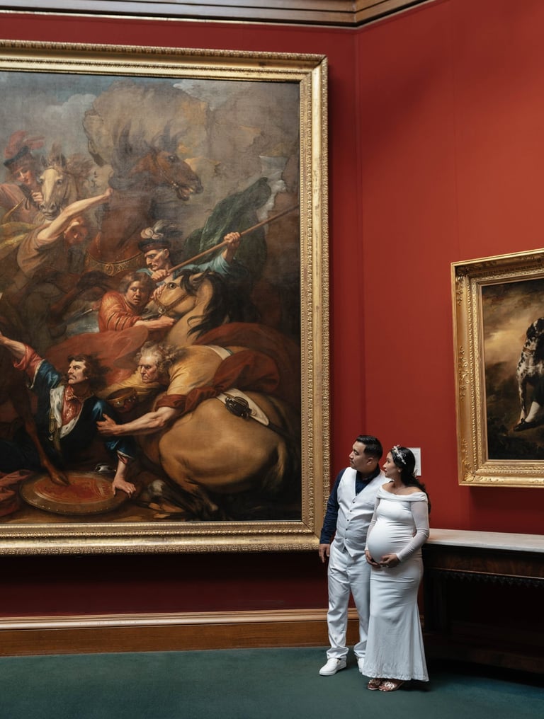 a man and woman standing in front of a painting