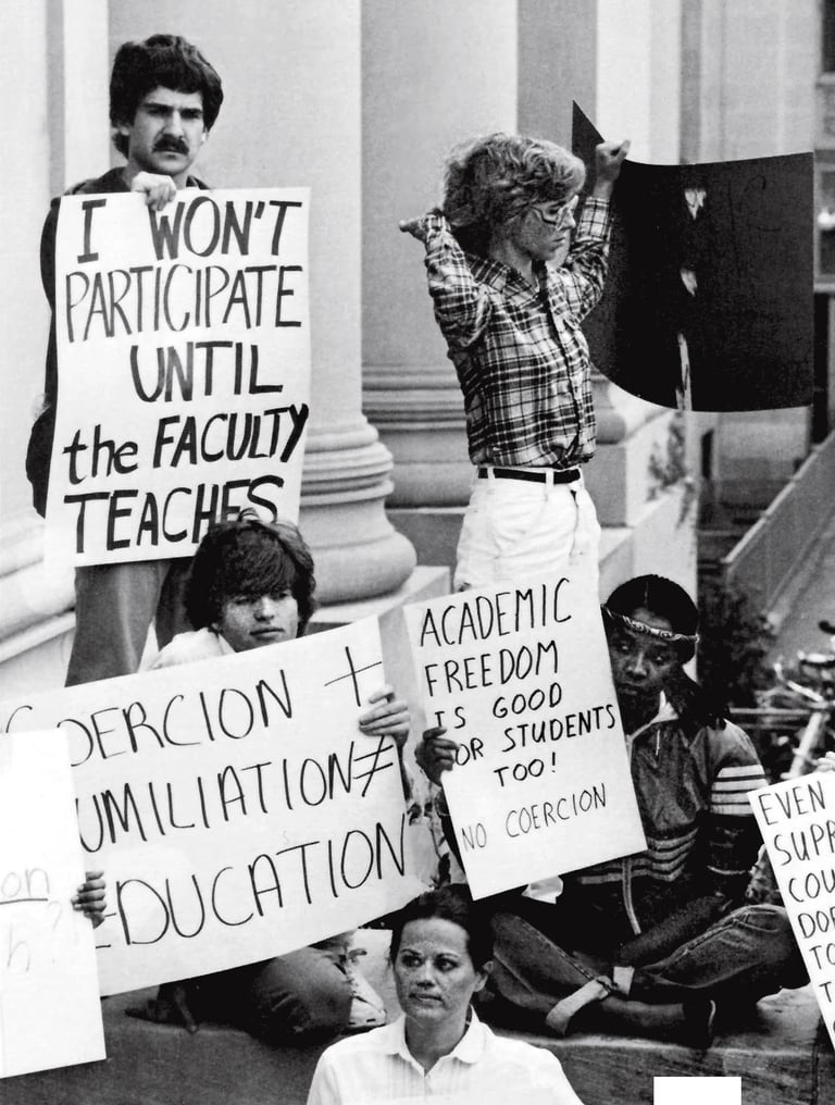 a group of people holding protest signs