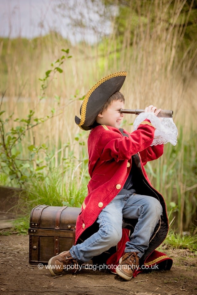 Young boy dressed as a pirate for storytelling photography session