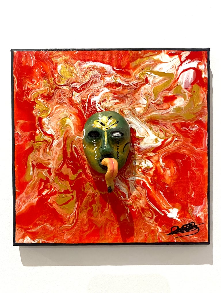 une sculpture avec une longue langue qui émerge d'un tableau rouge