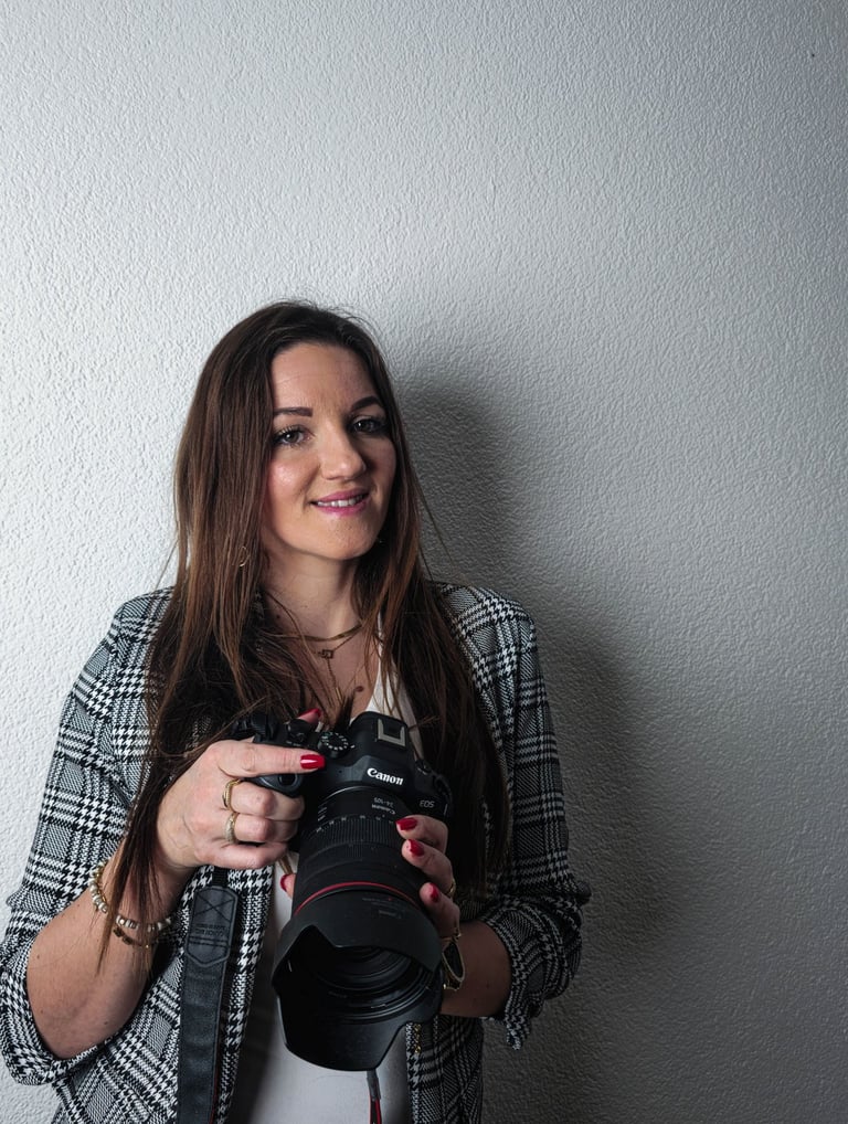 me holding a camera and taking a picture