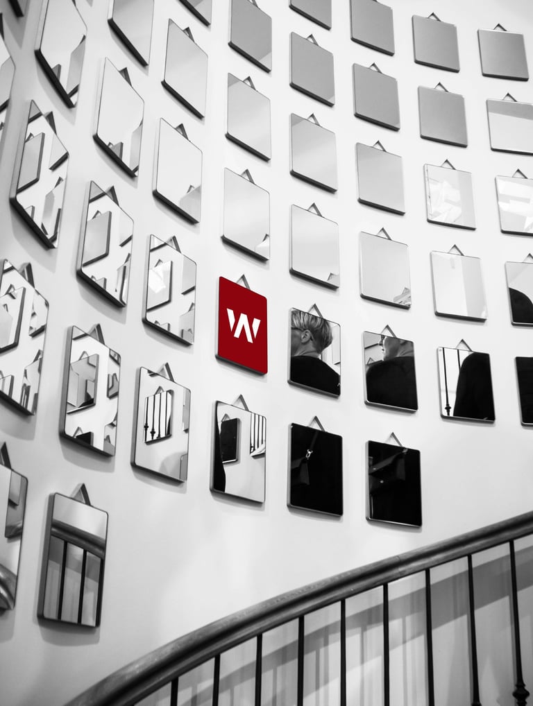 a wall of mirrors with a red light on it