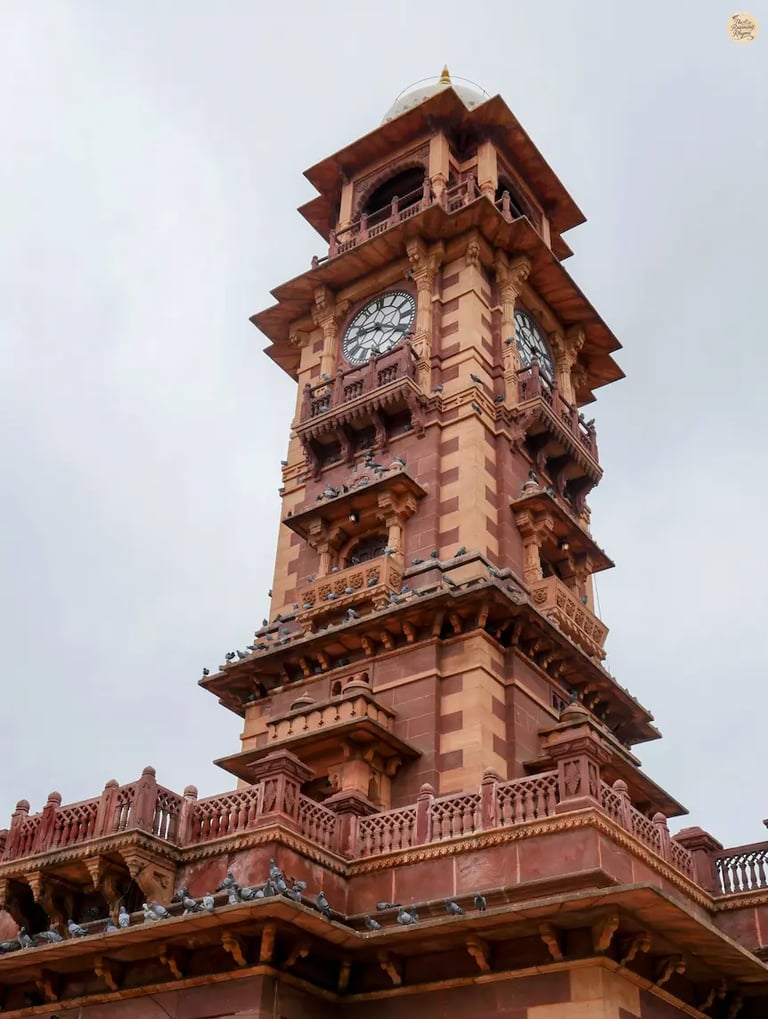 Iconic Ghanta Ghar Jodhpur standing gracefully above the vibrant streets of Sardar Market in the Blue City.