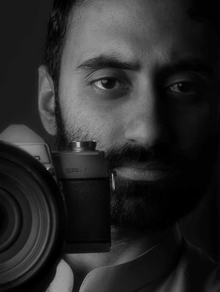 a man with a camera and a camera