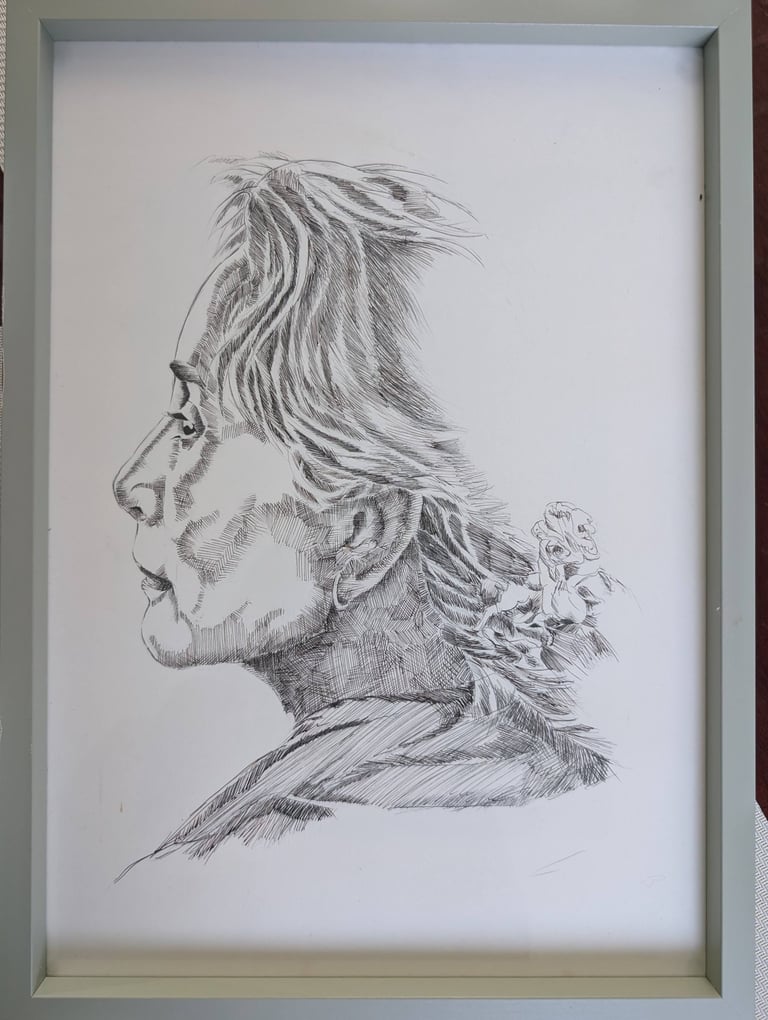 Side of Aung San Suu Kyi's face drawn by black ink pen