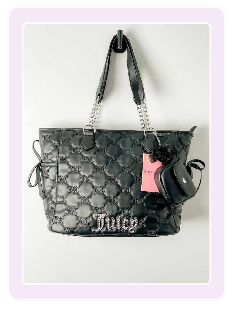 Black quilted Juicy Couture tote bag featuring silver chain straps and a pink rhinestone logo.