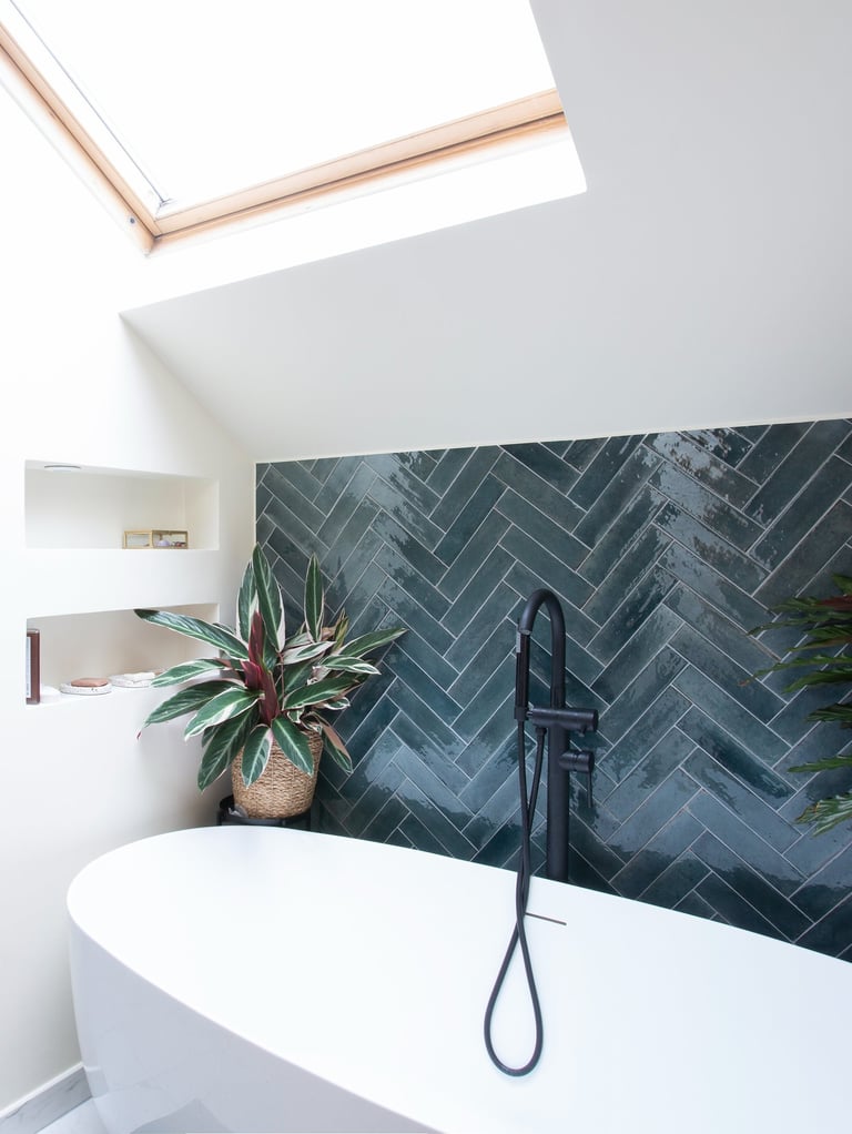 a bathroom with a bathtub and a skylight