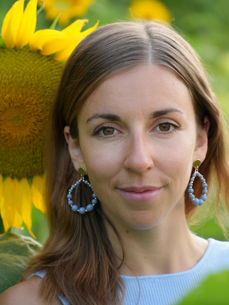 a woman with a sunflower in her hair