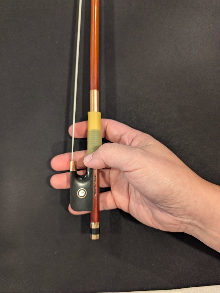 Curled thumb on the stick