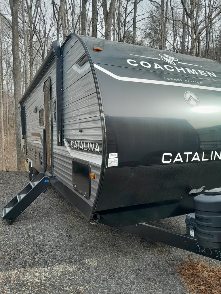 Temporary RV housing unit delivered to homeowner property during insurance repairs