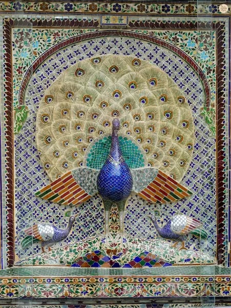 Intricate peacock design with mirrored tiles at Mor Chowk, City Palace Udaipur Rajasthan.