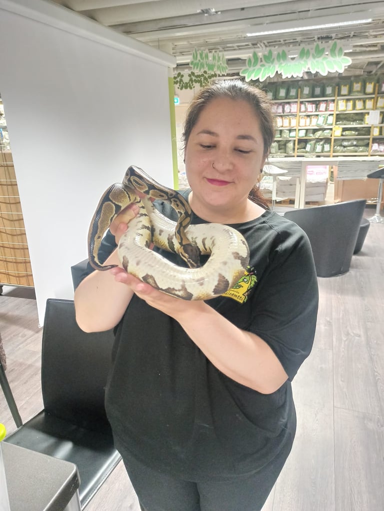 a woman holding a snake snake snake snake snake snake snake snake snake snake snake snake