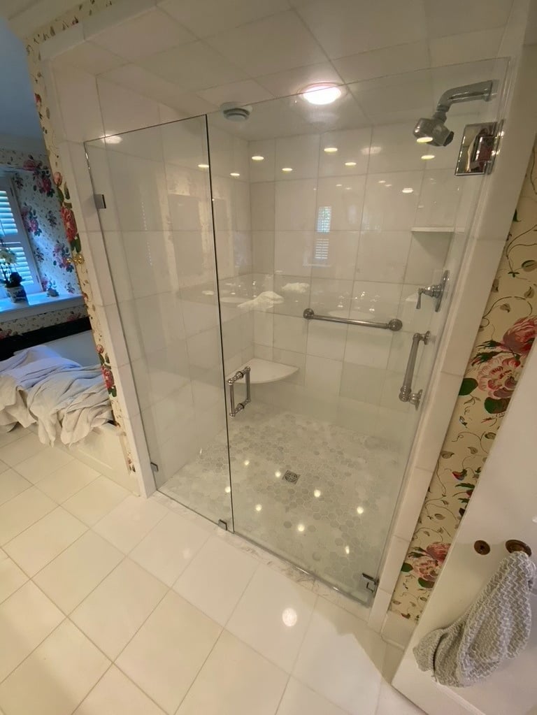 marble tile frameless glass shower doors octagon tile curbless shower remodel by Golden Rule 