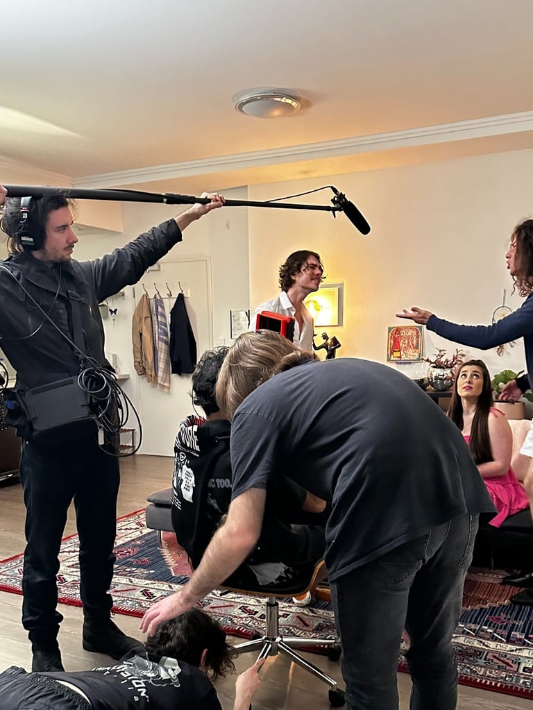 a man is filming a video camera and another is filming a video