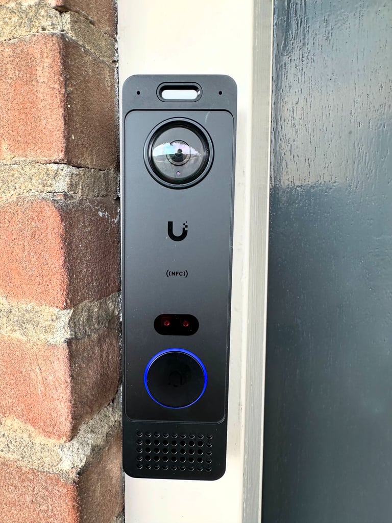 Ubiquiti UniFi Protect security camera dashboard showing a delivery person on a balcony.