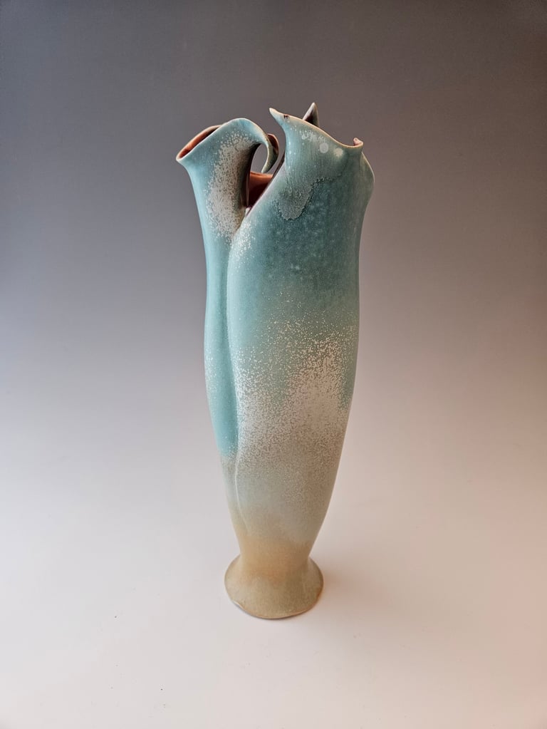 Tall Sharp Lily Vessel teal micro-crystalline exterior glaze with deep red glossy lining