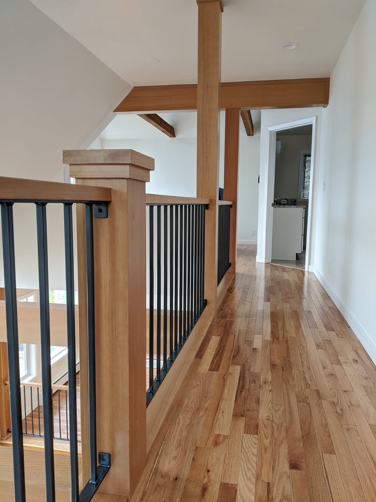 Fir wrapped posts, open iron railing