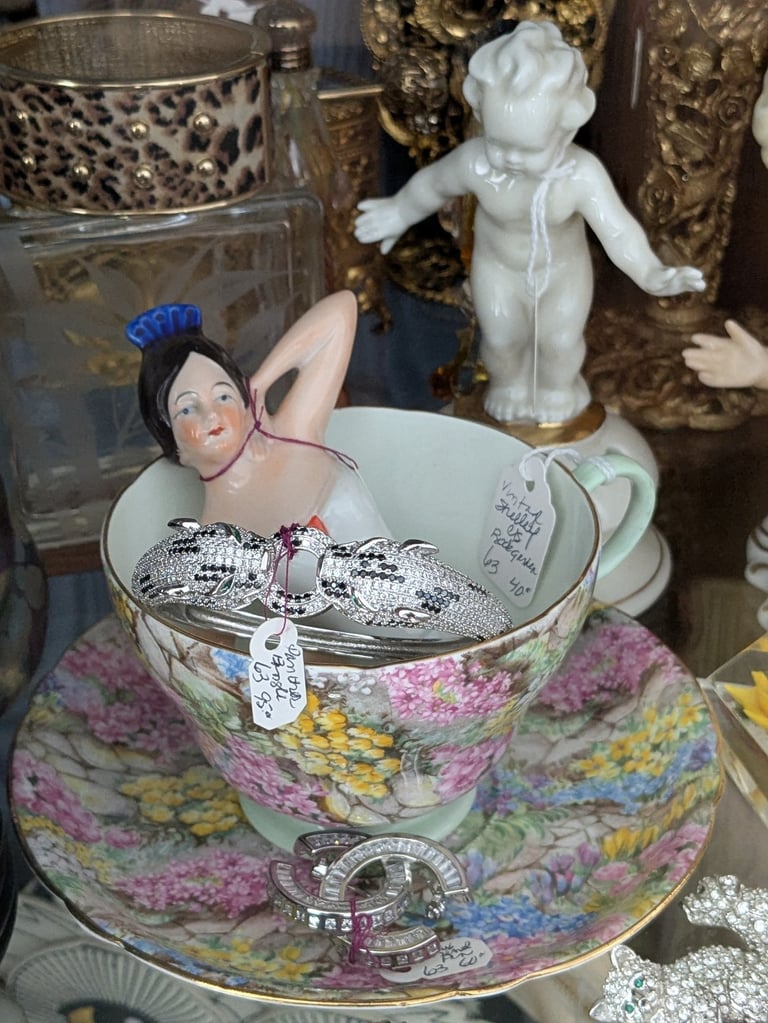ceramic woman in a teacup