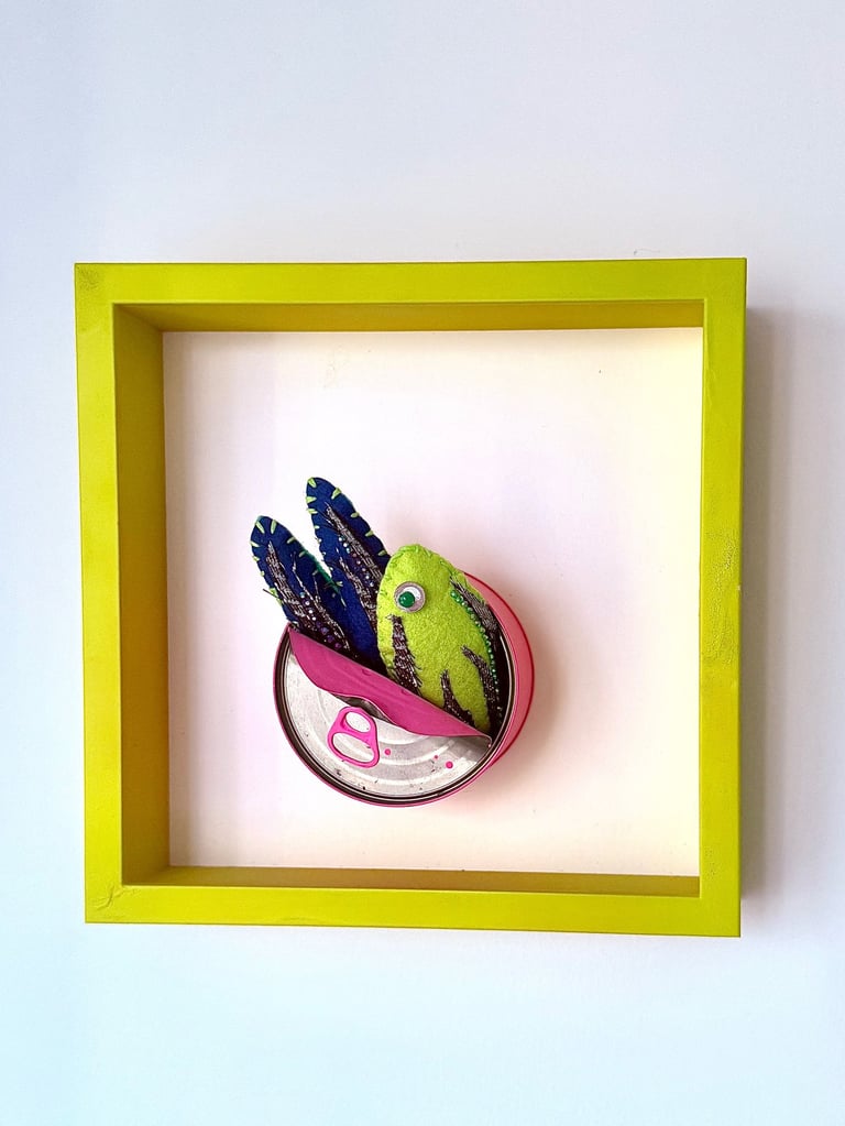 framed tinned fish sculpture neon green/yellow/blue  shiny fish in pink tin