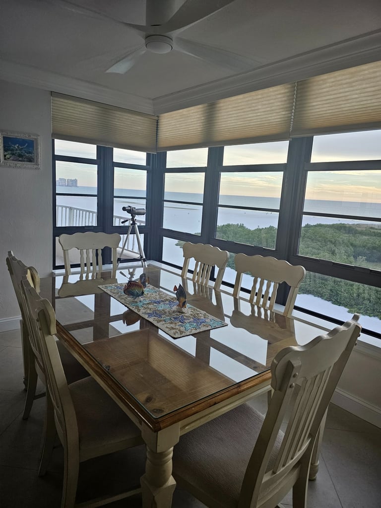 a dining room table with chairs and a table