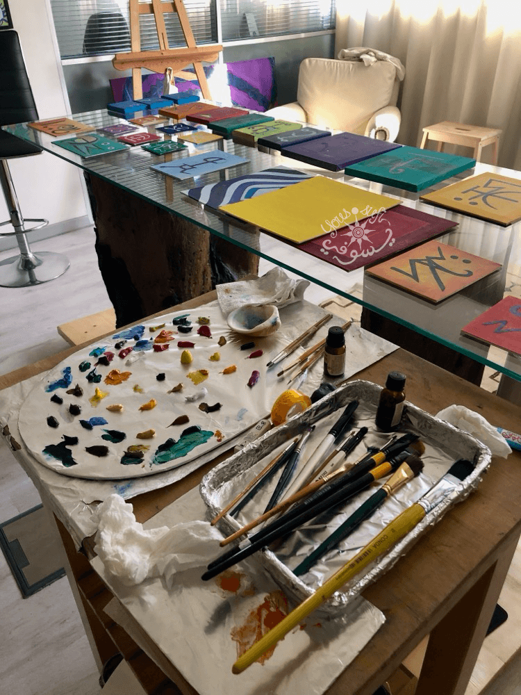 oil paints on palette and paintings by Artist Yous