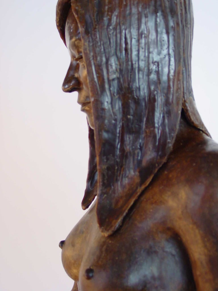detail of wax model upper torso, hair and face