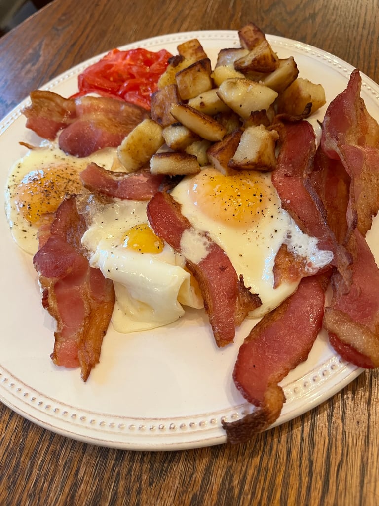 Photo of bacon and eggs cooked by author Robert Ellis for an early supper.