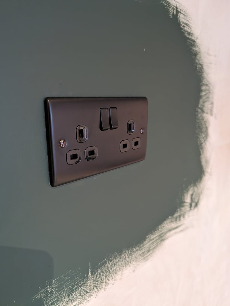 a black and white electrical outlet in a wall