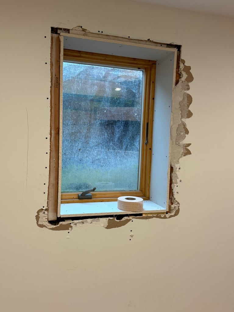 damaged drywall around window in residential home