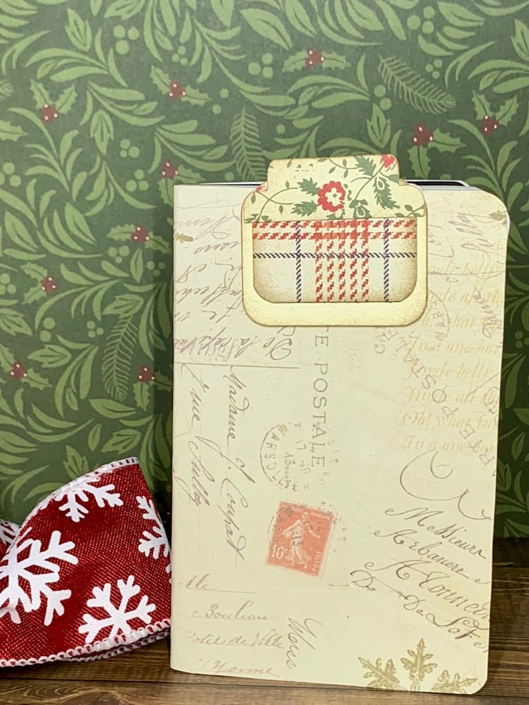 Christmas-themed letter (postal) covered notebook and hidden paper clip