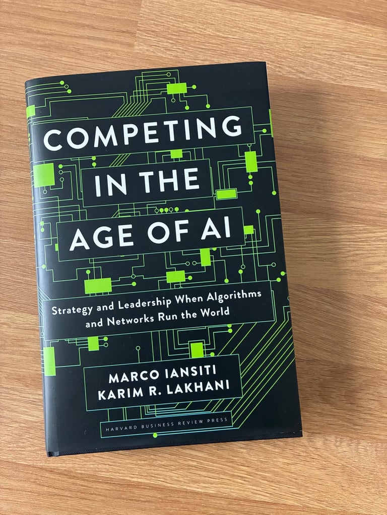 A phot of the book Competing in the age of AI