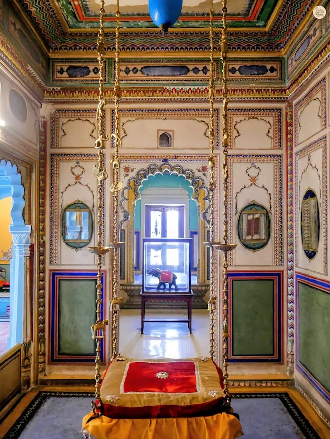 Bhim Vilas at Udaipur City Palace Rajasthan, adorned with intricate murals and mirror work.