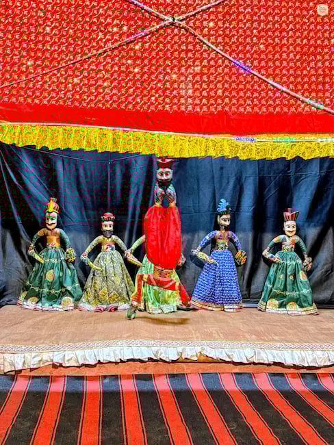 Enjoy a traditional Rajasthani puppet show at Gulab Garh Jaipur, a classic folk storytelling performance.