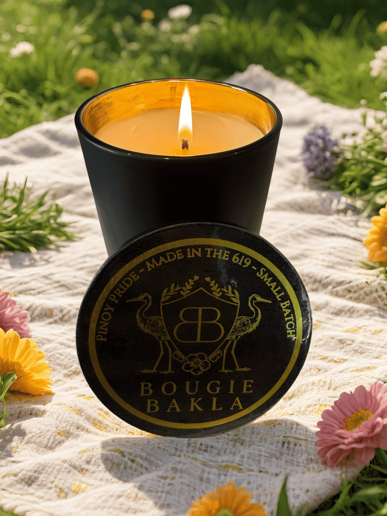 a candle with a candle in a black candle holder