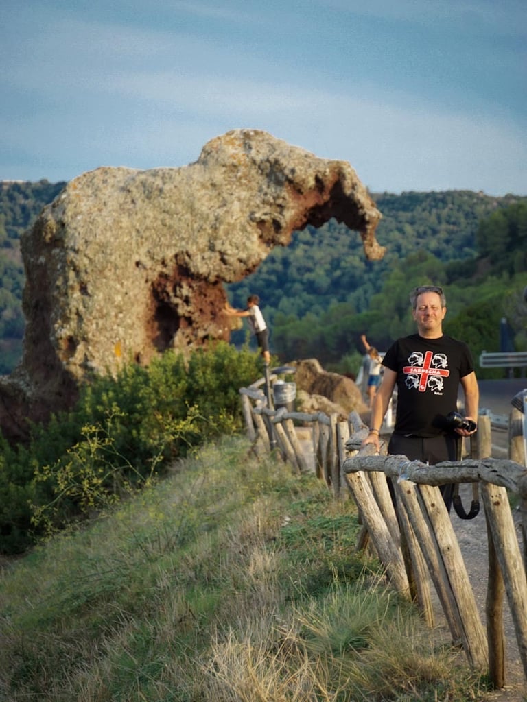 Franco Prisco at Roccia dell’Elefante in Castelsardo, Sardinia, with UNESCO-listed domus de janas.