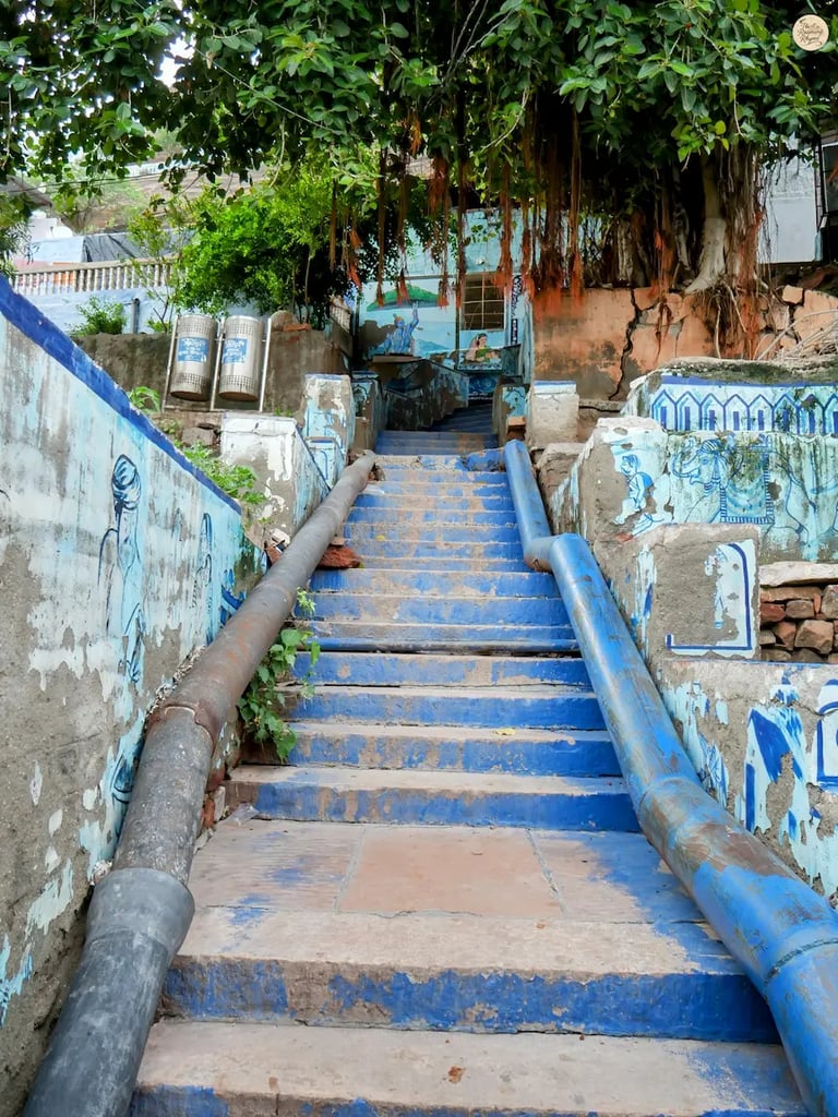 Blue Corridor stairs decorated with Rajasthani wall art, leading up to Pachetia Hill viewpoint, Jodhpur