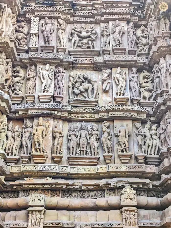 Erotic sculptures on the outer wall of Vishvanatha Temple Khajuraho Mdhya Pradesh.