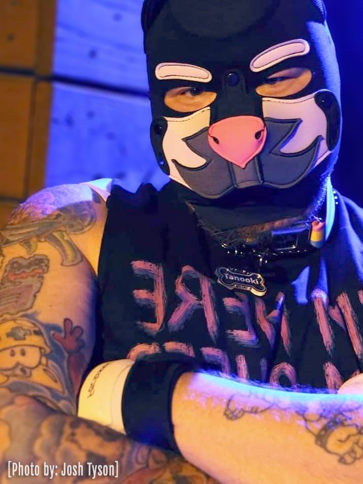Man in a pup mask.