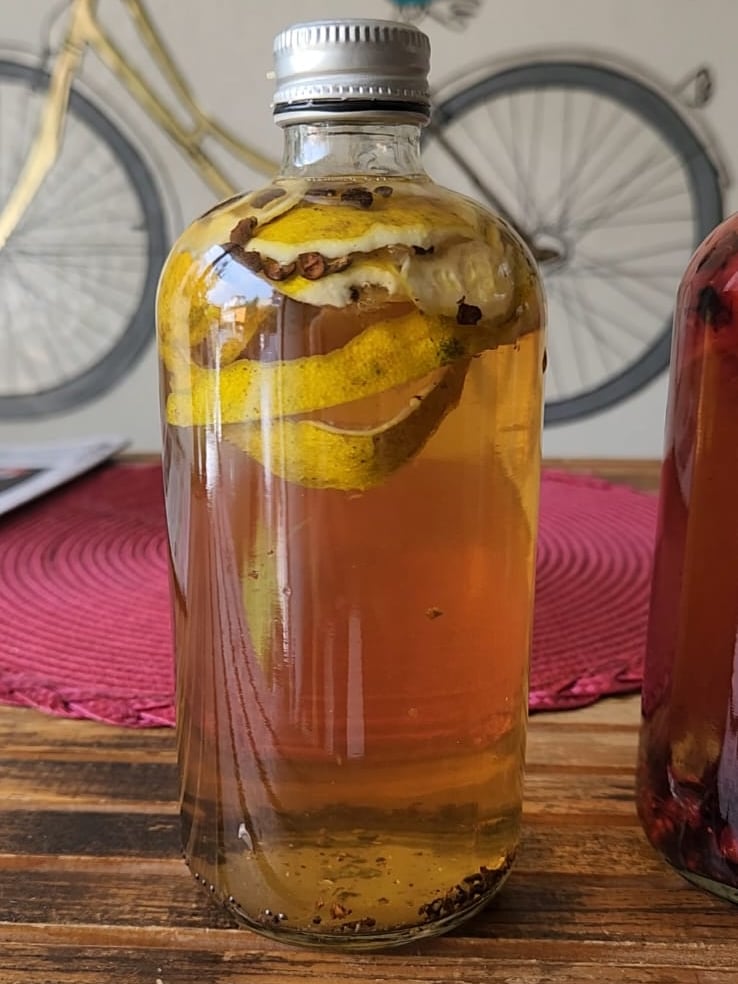 a bottle of kombucha with orange