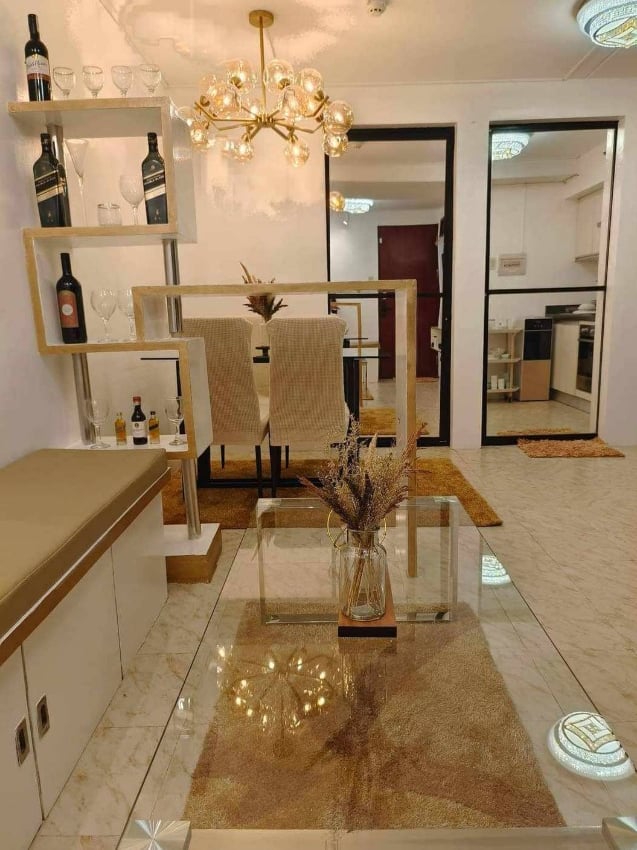a living room with a glass table and a glass table