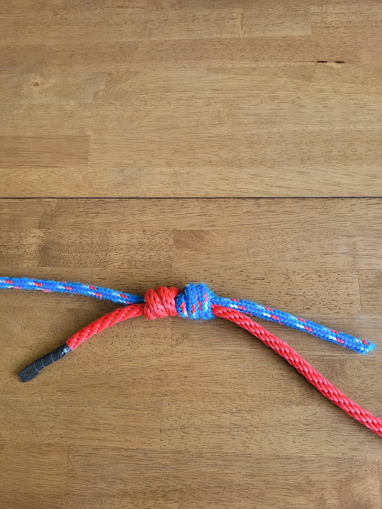 Triple Fisherman's Knot after a heavy pull, showing the junction "welded" together.