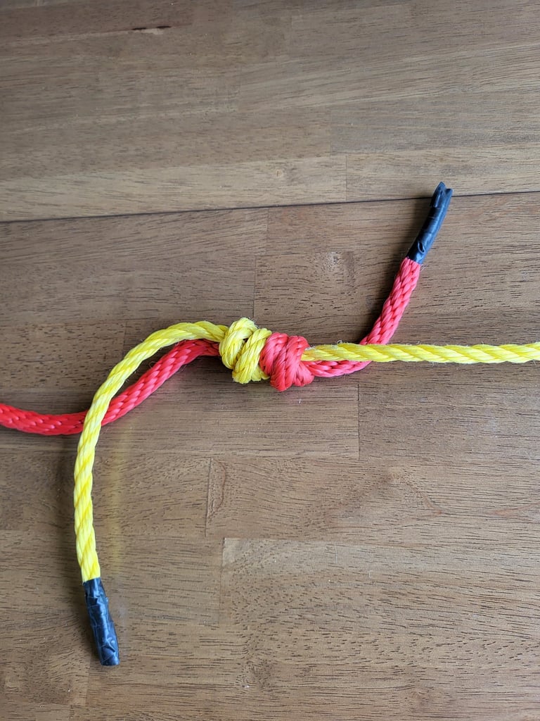 Double Fisherman's Knot with two different ropes.