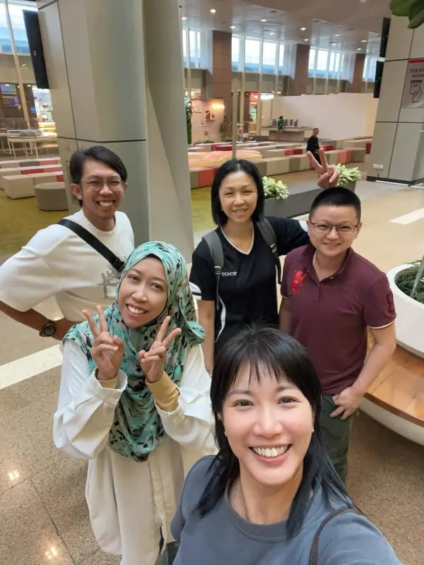 Singapore homeowners celebrating their property milestone with the Lim Sisters