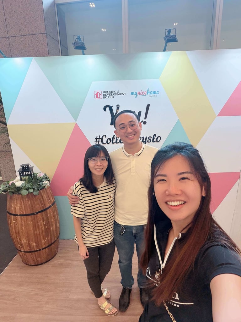 Happy homeowners with Tracy and Colelyn after a successful property journey in Singapore