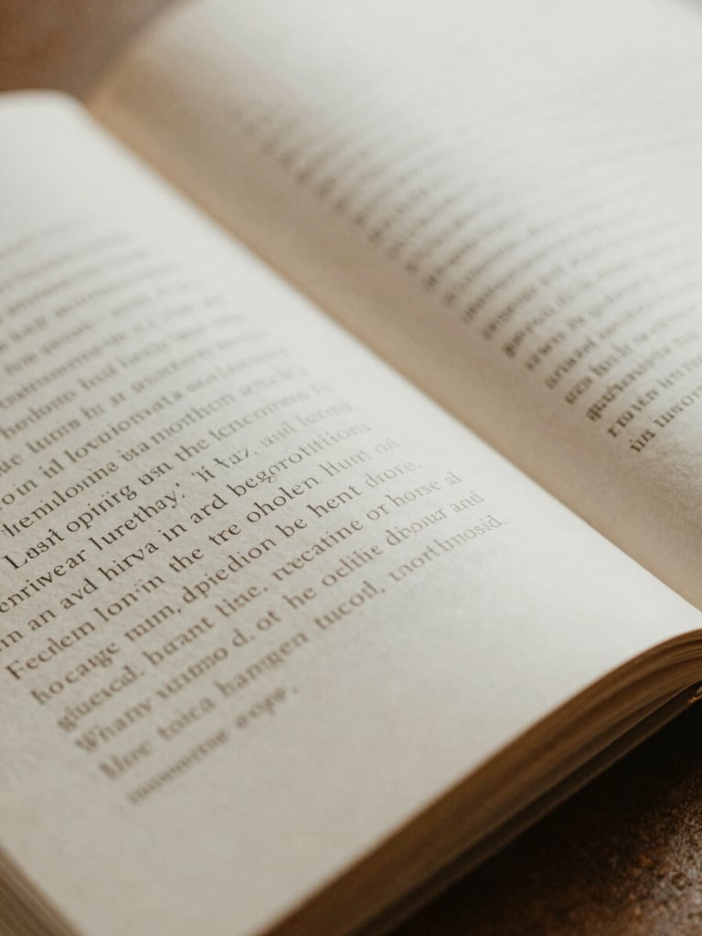 Tactile close-up of open book pages showing elegant typography, soft diffused daylight on warm paper texture, shallow depth of field, 35mm