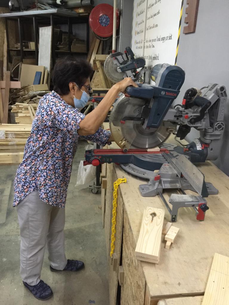 Lady managing a mitre saw
